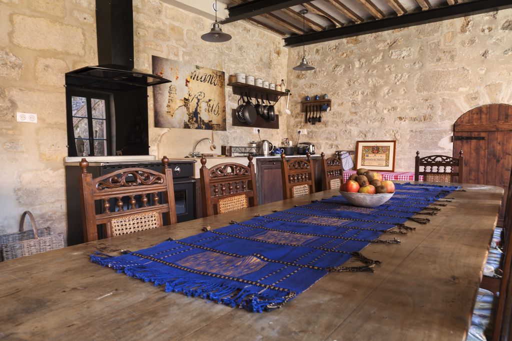 Rustic dining and kitchen area inside of Chez Jules & Léonie 