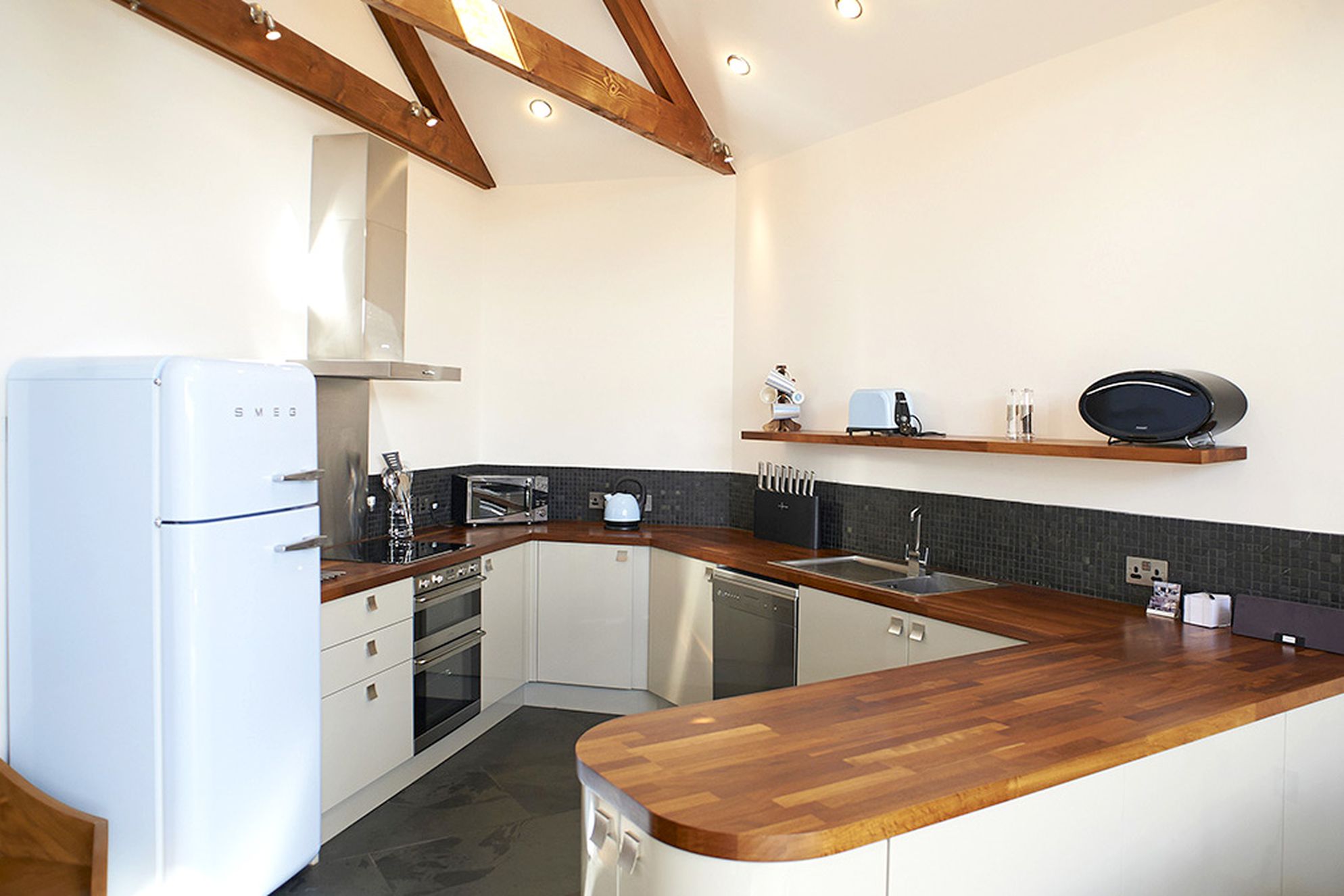Merlin Farm Cornwall modern style kitchen with Smeg fridge
