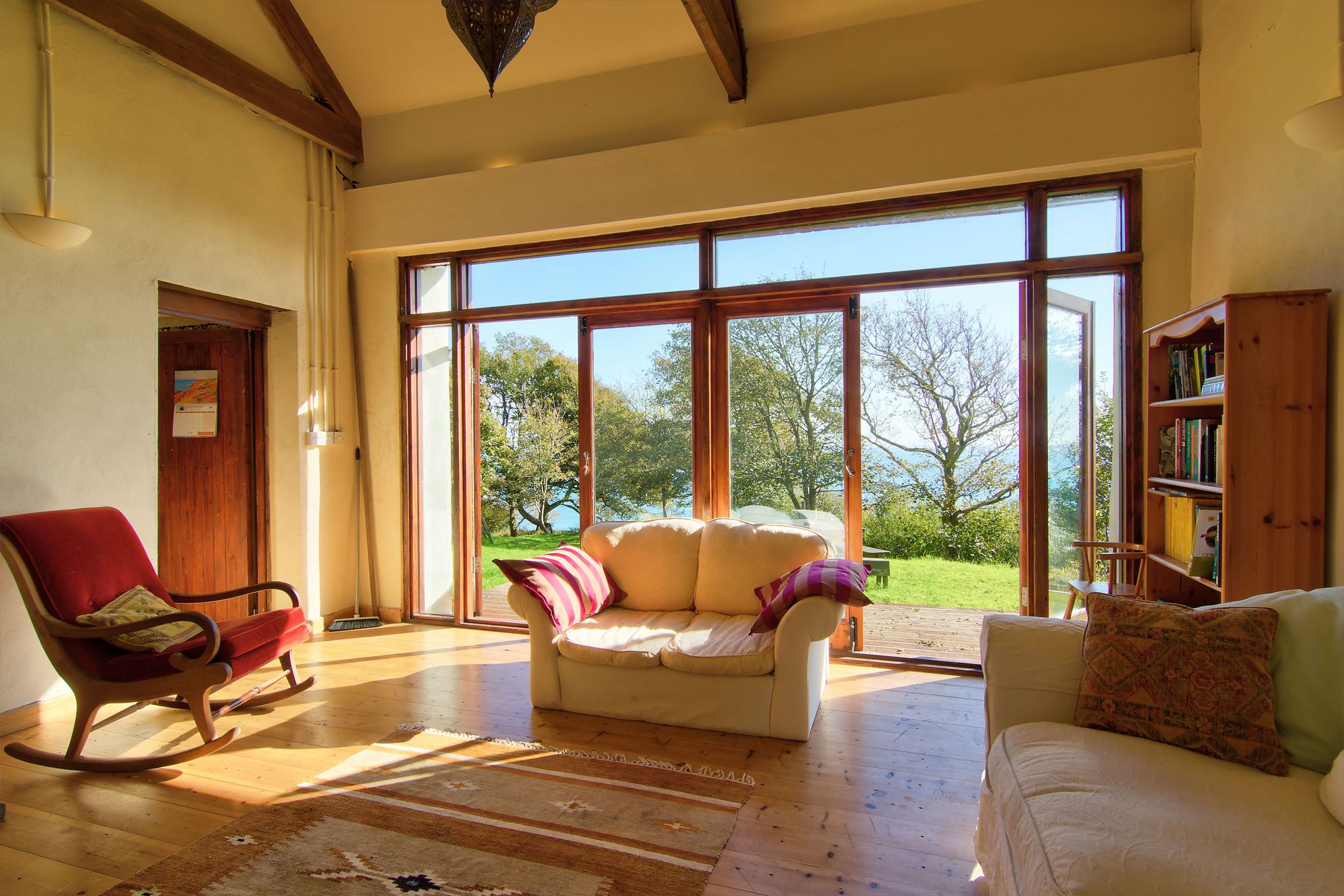 Lounge with double doors leading onto the garden