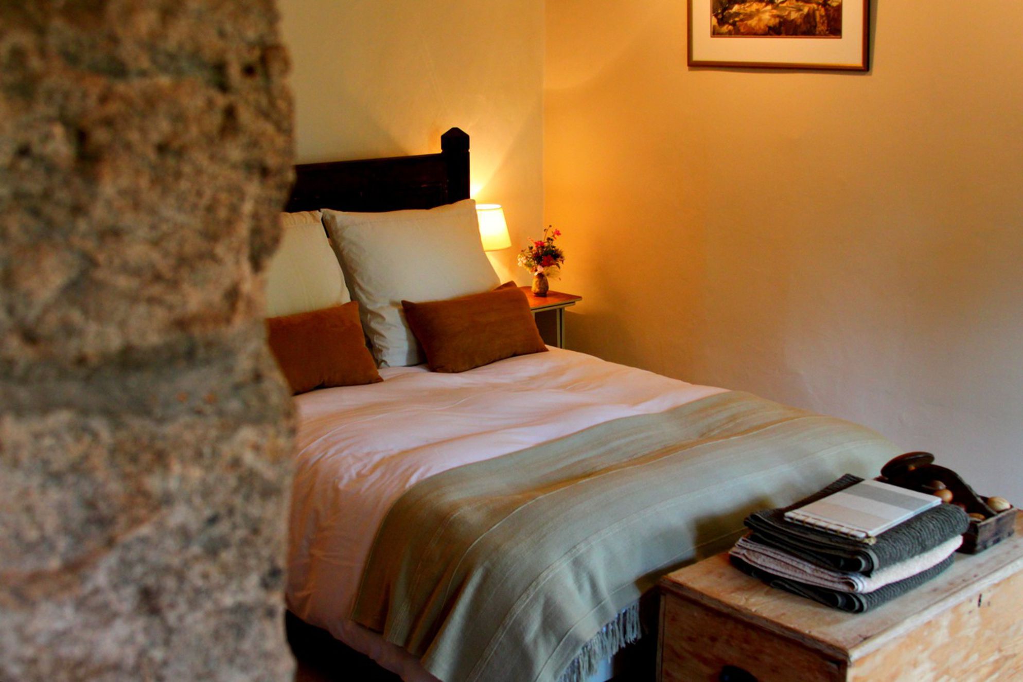 Cosy bedroom with double bed and storage
