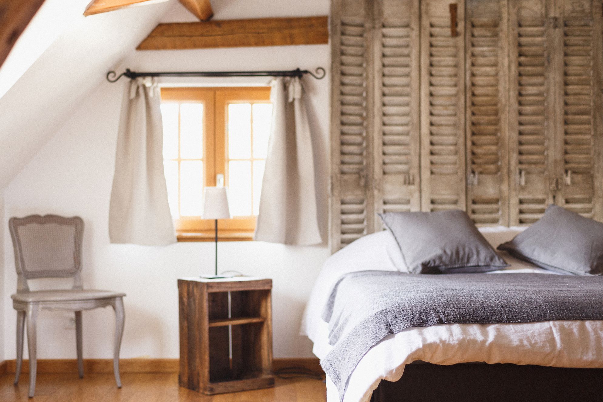 Double bedroom with the sun shining in through the window