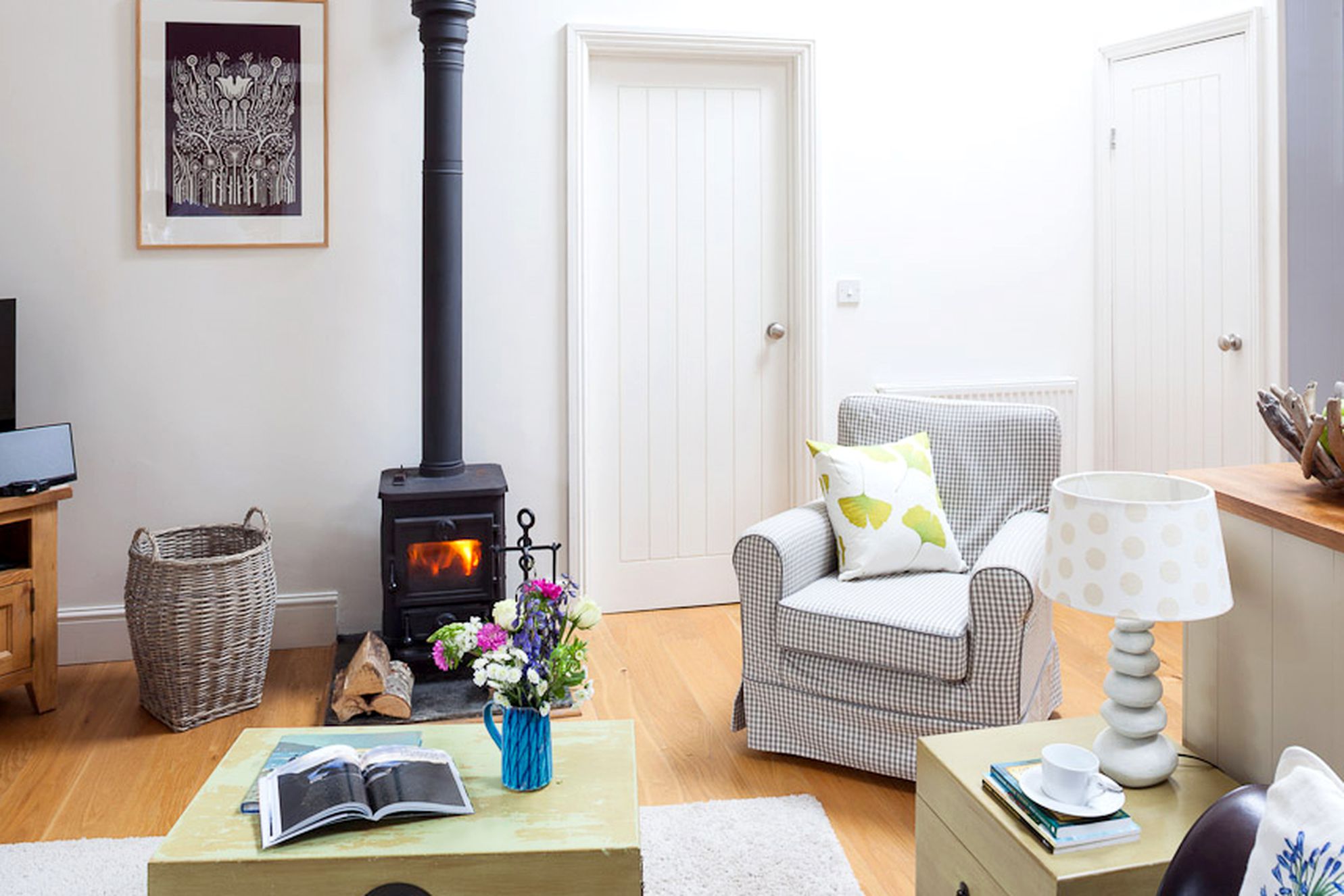 Cosy sitting room with log burner at Bolotho Barns, Skylarks in Cornwall