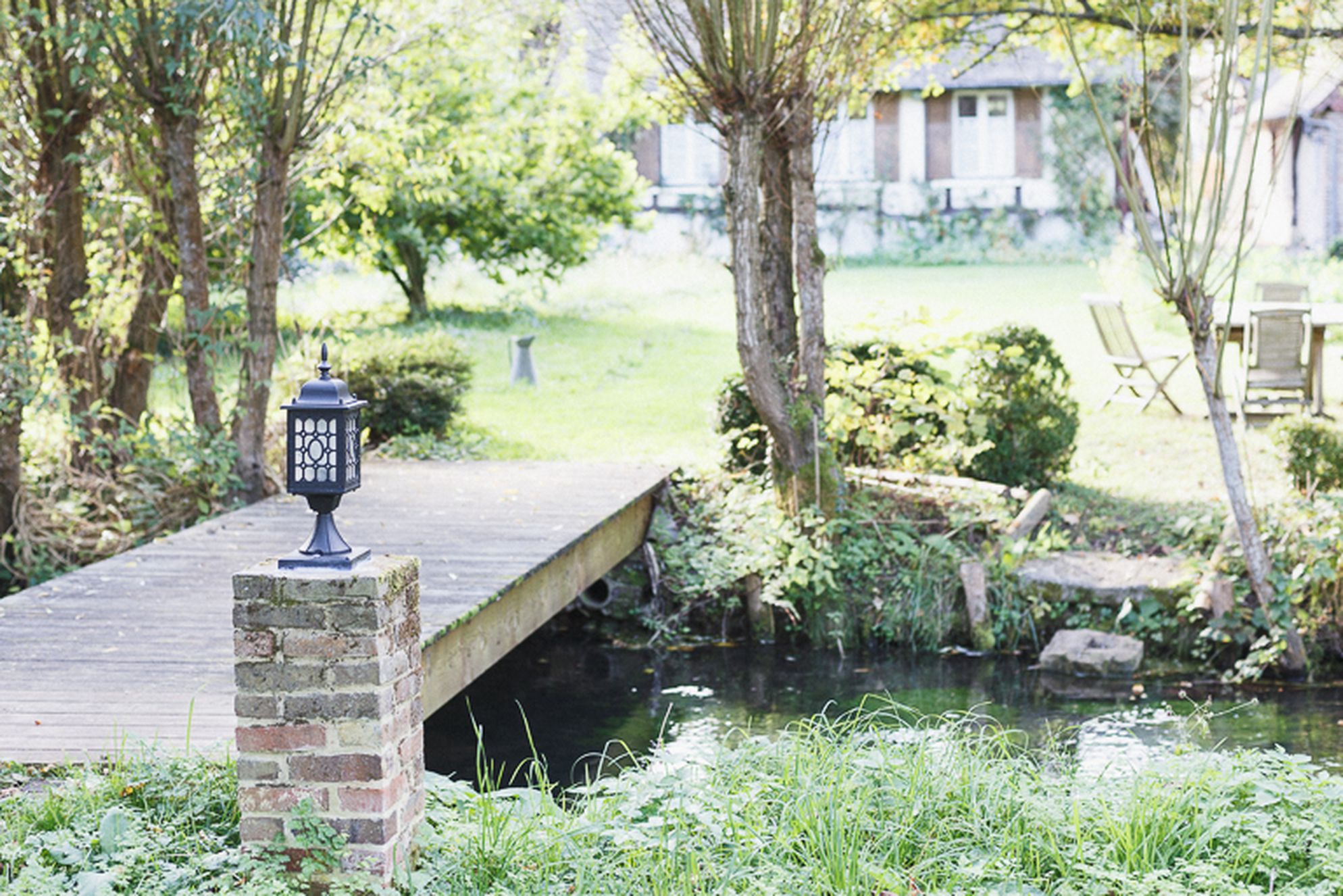 Bridge over stream amongst the gardens and orchards at La Lévrière