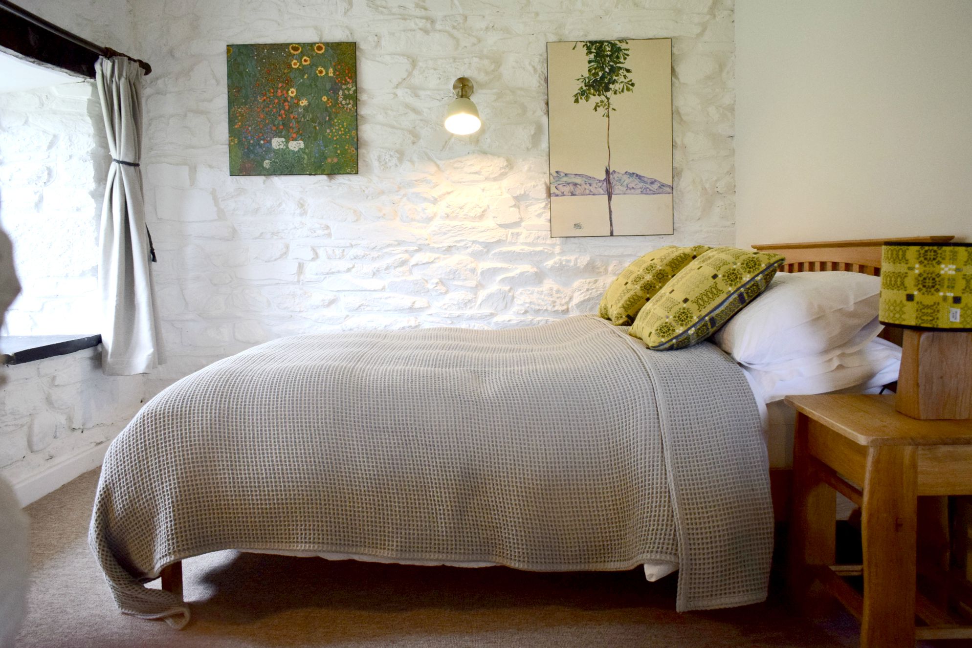 Cosy but rustic bedroom in The Tudor Kitchen in Newport