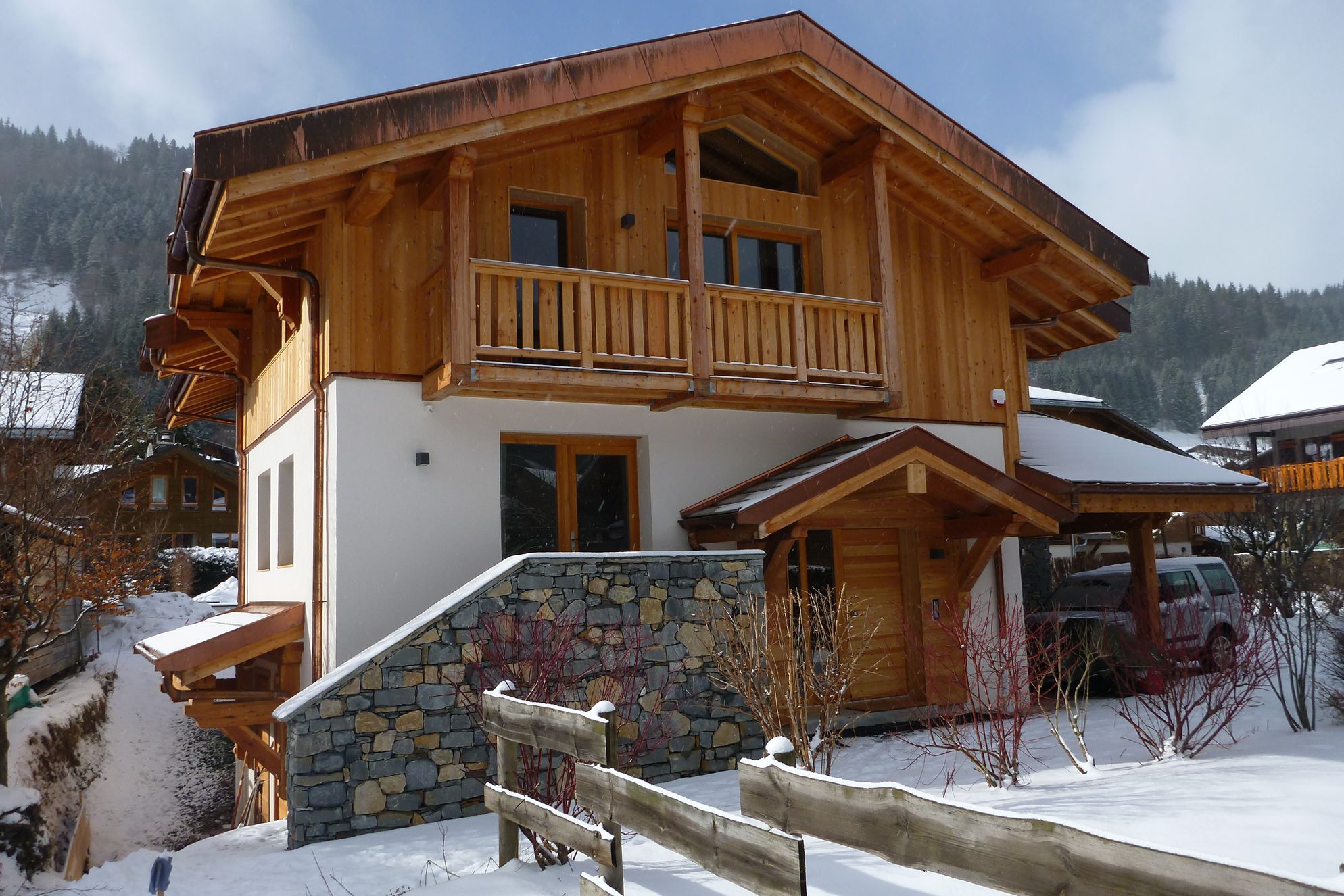 Exterior of the modern chalet, Les Roches Noires in the snow of Morzine, Savoie in France