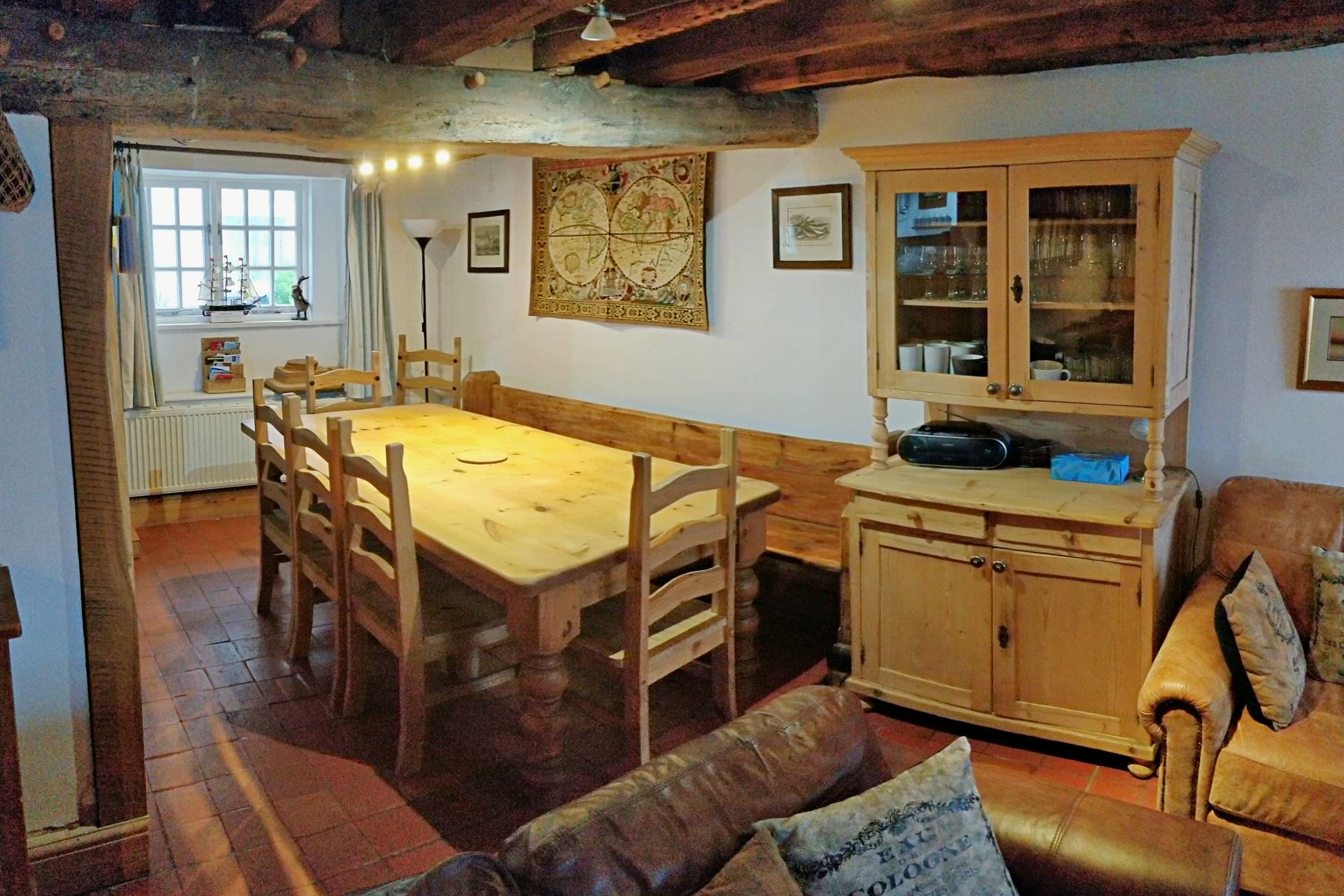 Dining table with wooden beamed ceiling