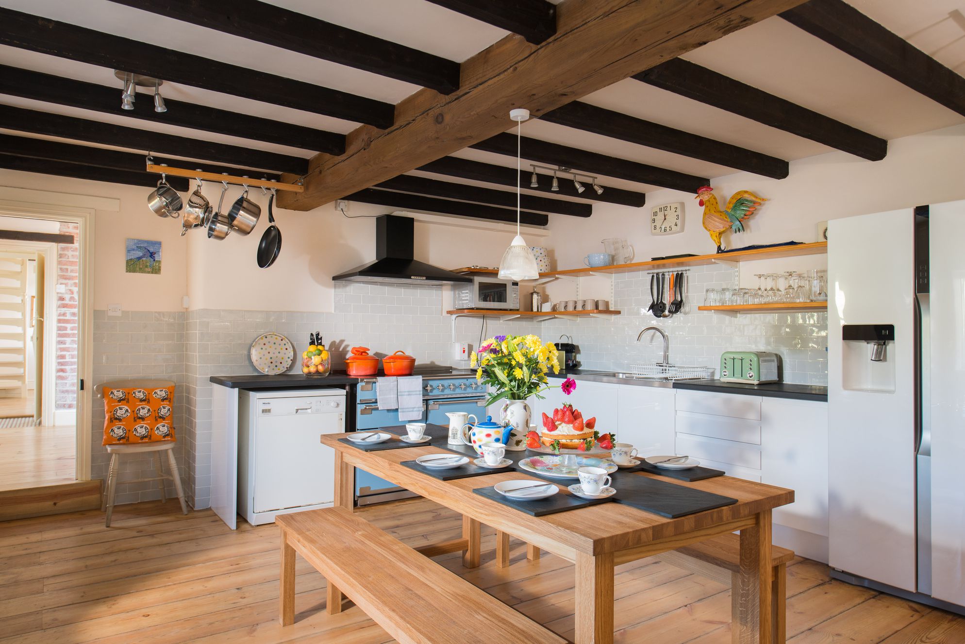 Kitchen with table ready for tea and cake