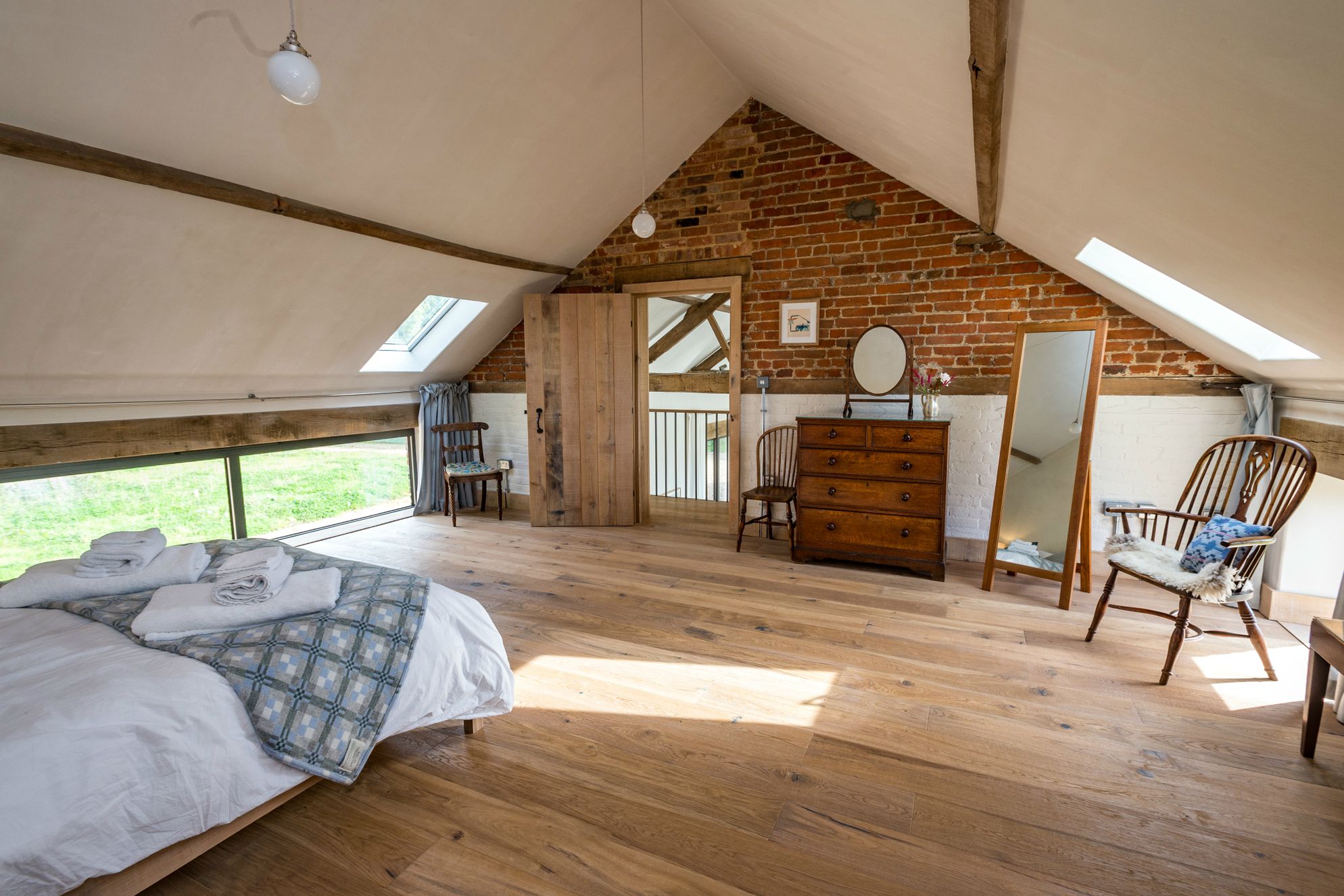 Upstairs spacious bedroom with double bed in Old Hall Farm Barn