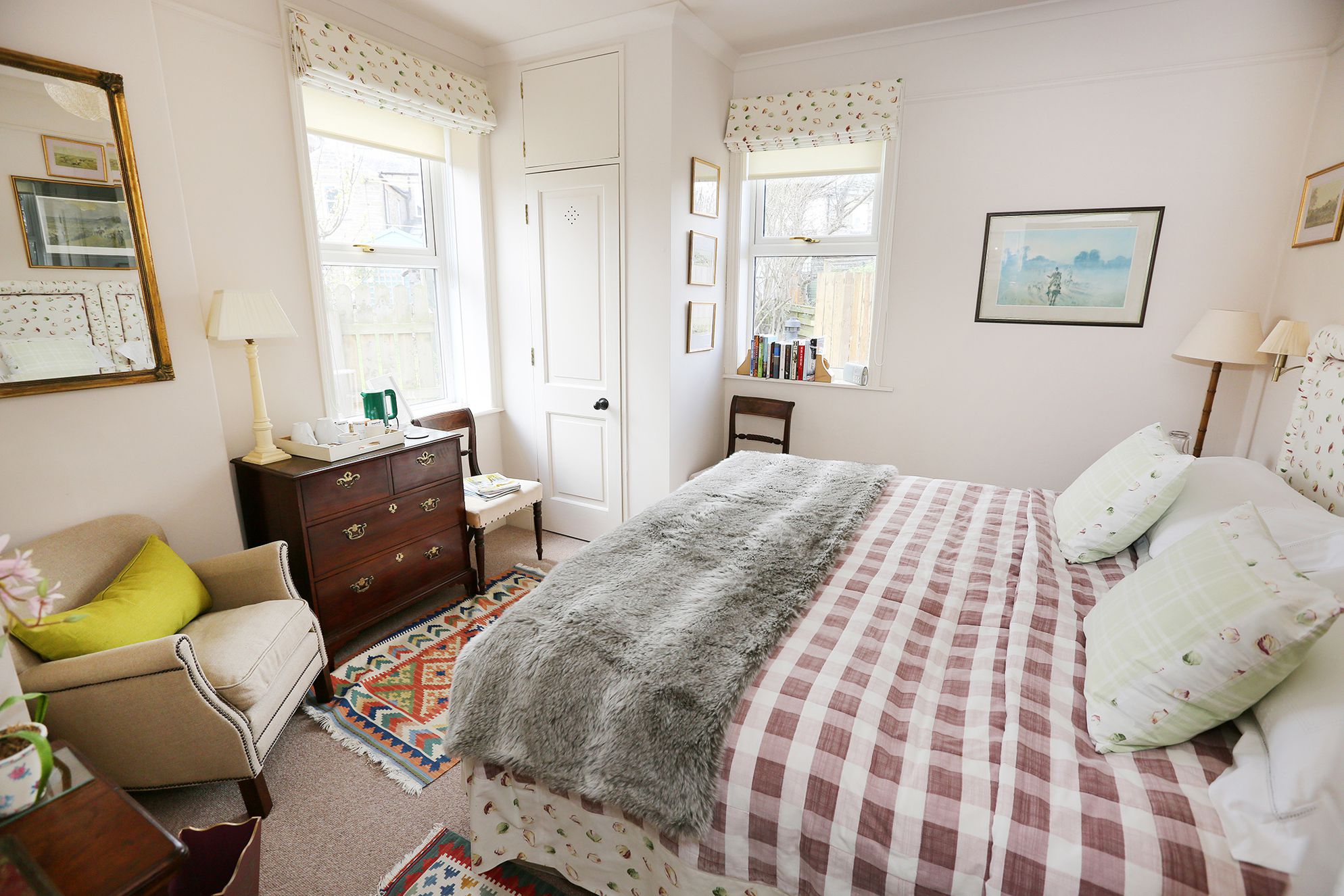 Double bedroom with a comfy armchair and a couple of chairs for relaxing in, as well as big windows letting lots of light in