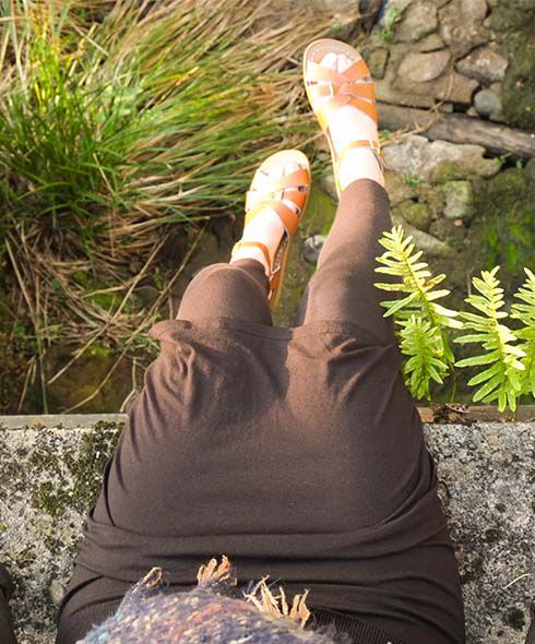 Legs dangling over a wall in Galicia 